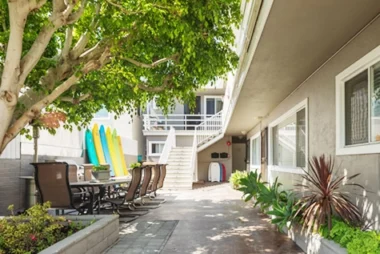 Men's Surfside Courtyard with surfboards