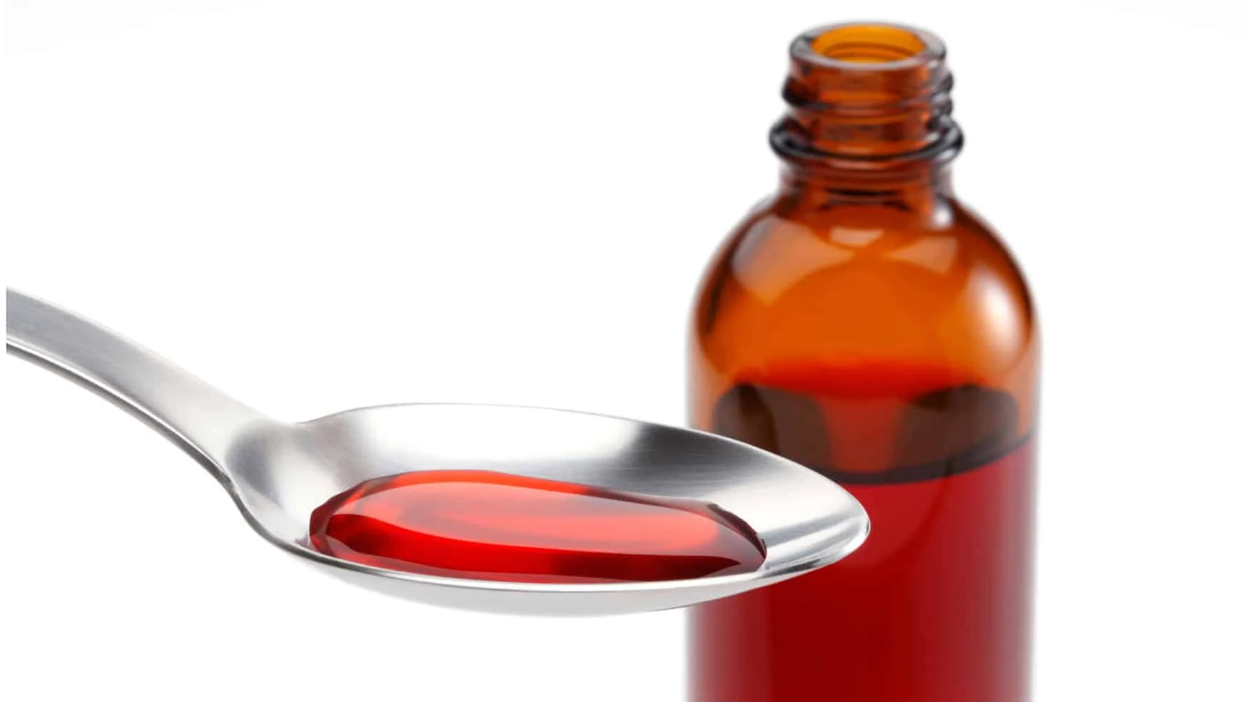 a bottle of cold medicine an a spoonful of the medication How Does NyQuil® Work? a bottle of cold medicine an a spoonful of the medication How Does NyQuil® Work?