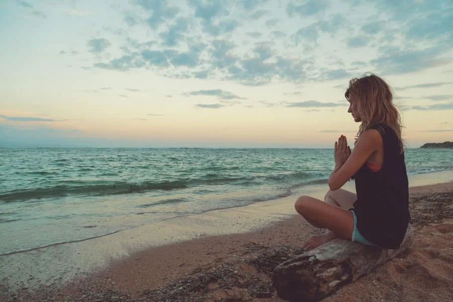 Woman performing salt water therapy for relaxation and wellness