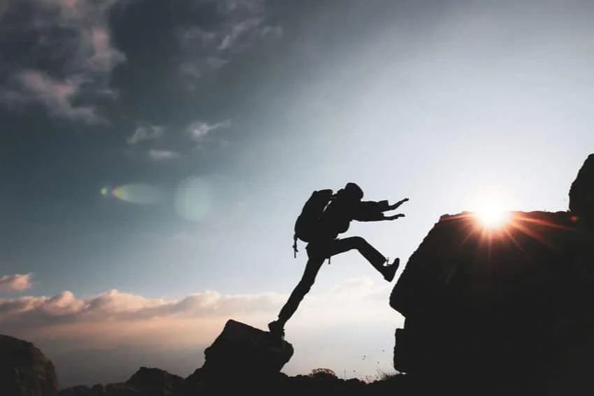 Person reflecting during a challenging moment in addiction recovery