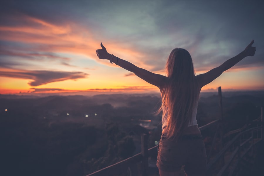 Person facing fears and moving forward with confidence.