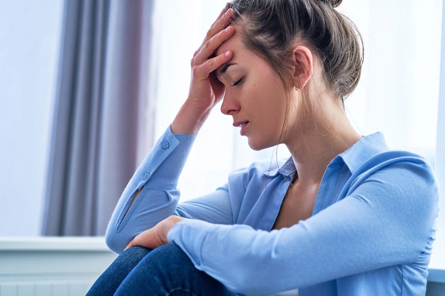 Woman reviewing symptoms of Xanax dependence and abuse