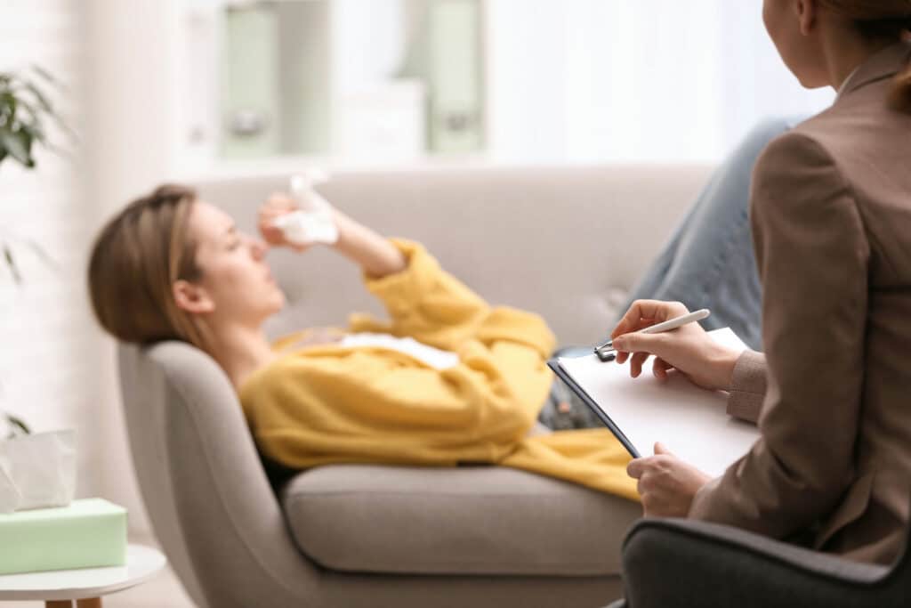 Person in therapy learning about Adderall and anxiety treatment