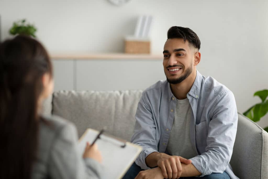 Man attending therapy about long-term Adderall effects on personality, behavior, and brain.