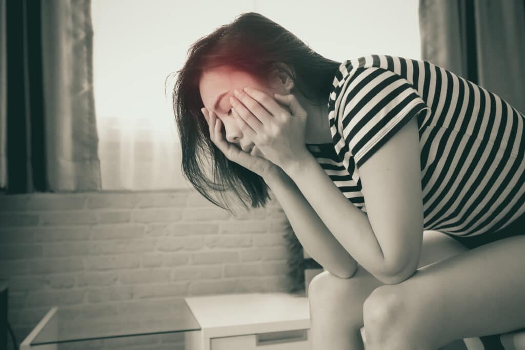 Woman experiencing Baclofen withdrawal symptoms