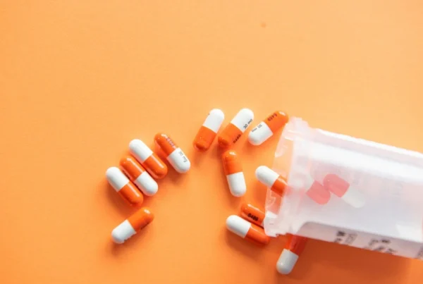 Lyrica pills spilling out of a pill bottle onto a surface
