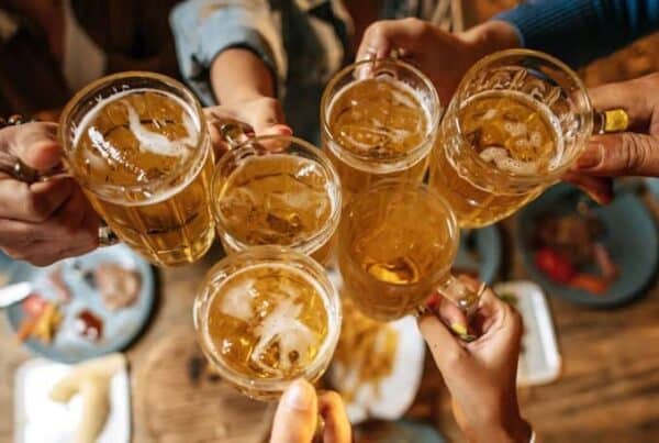 a group of friends cheering with beer