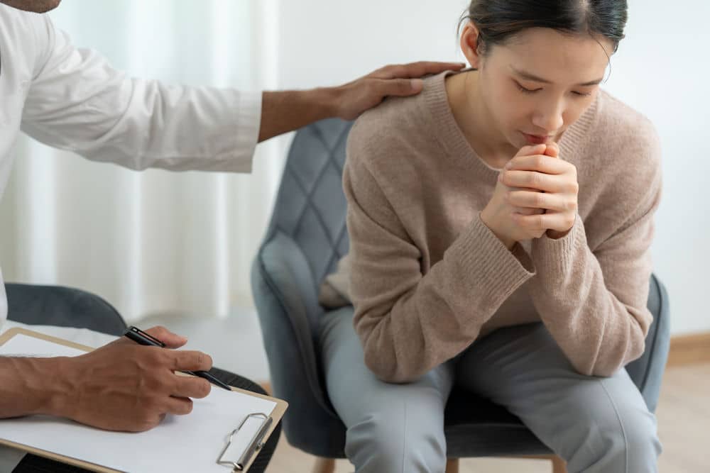 a-person-being-comforted-by-therapist