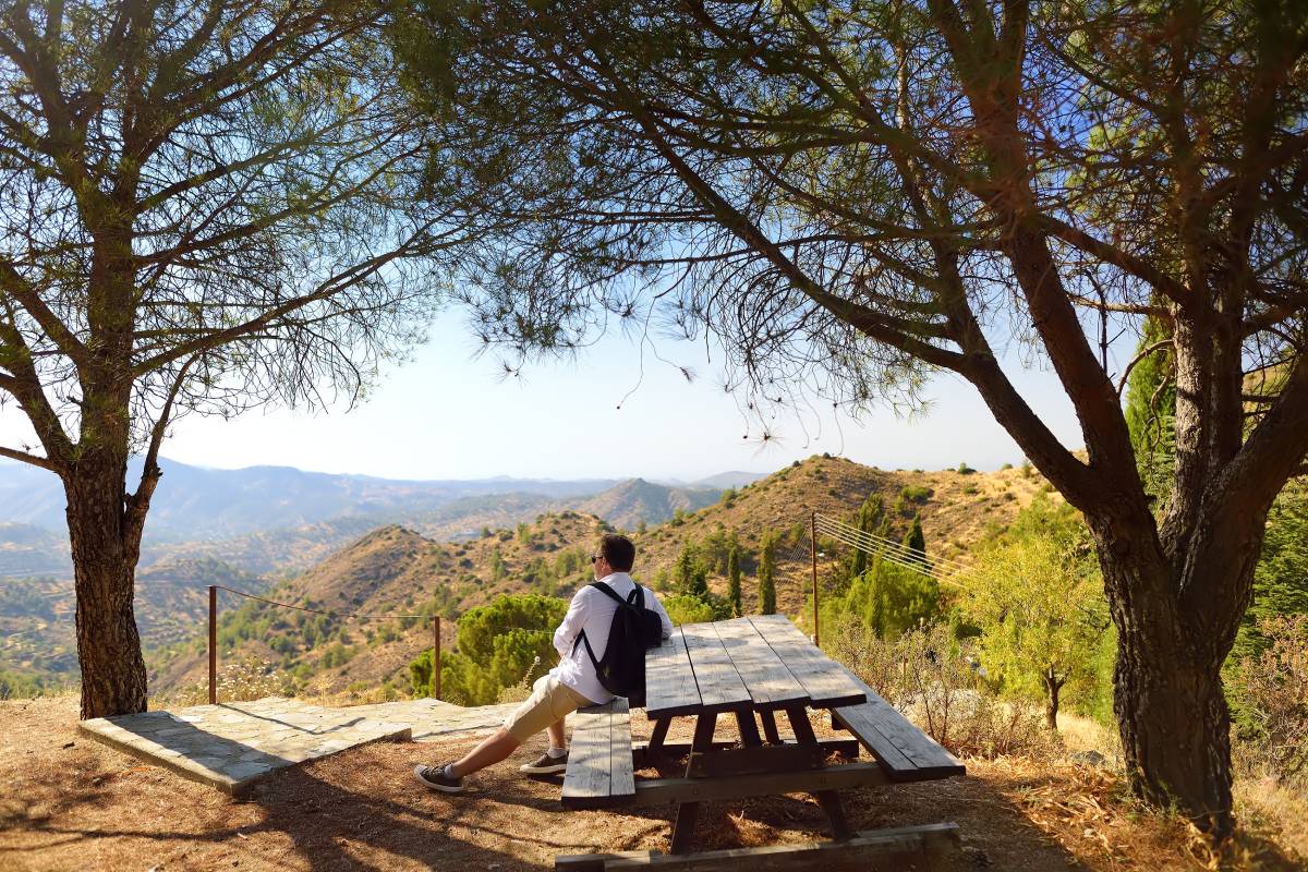 man sitting on a mountain chair, enjoying peaceful sober activities in santa ana