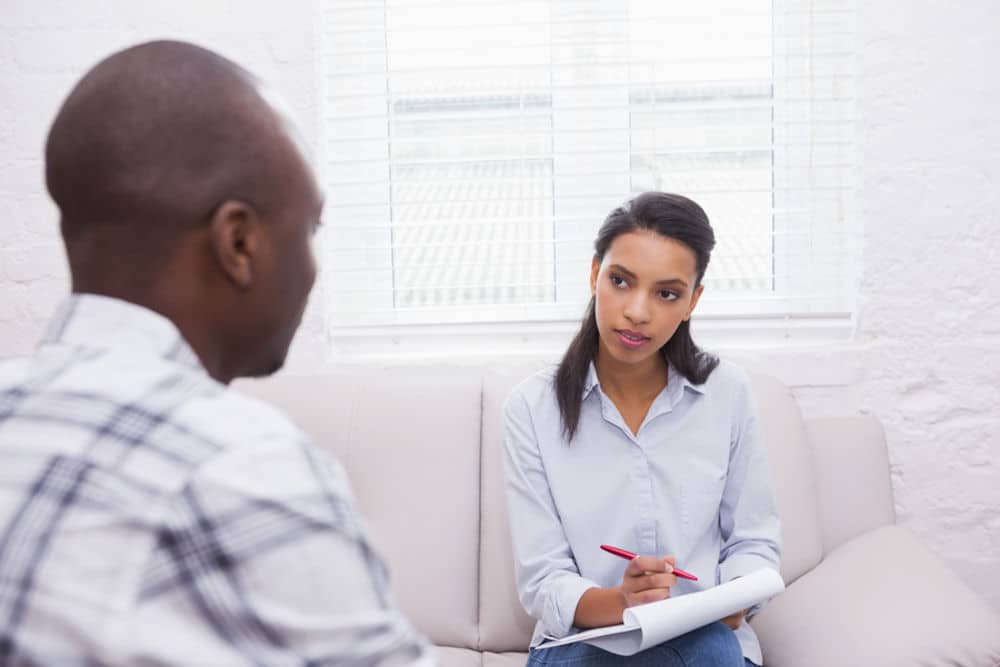 Counselor and patient discussing fentanyl addiction treatment and recovery.