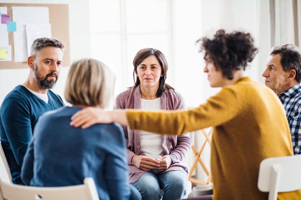 a-woman-being-comforted-in-therapy