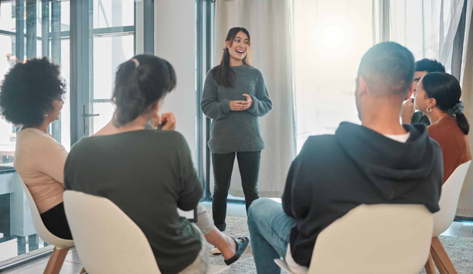 a-woman-speaking-in-group-therapy